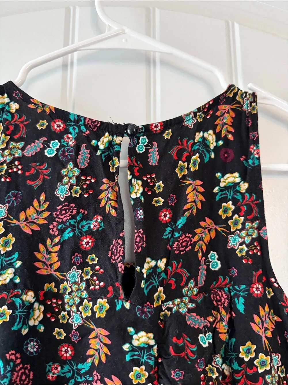 Gently worn Black Floral Ruffled Waist Sleeveless Romper